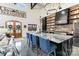 Bright kitchen featuring a large island with bar seating, black cabinets, and a breakfast area at 2288 Boheler Rd, Clover, SC 29710