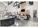 Spacious living room with a modern fireplace, high ceilings, stylish chandeliers, and an open concept design at 2288 Boheler Rd, Clover, SC 29710