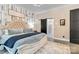 Serene main bedroom featuring a stylish barn door, neutral tones, and a cozy ambiance, perfect for relaxation at 2288 Boheler Rd, Clover, SC 29710