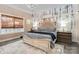 Tranquil main bedroom retreat with a decorative wood accent wall, plush bedding, and ample natural light at 2288 Boheler Rd, Clover, SC 29710