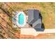Aerial shot showcasing a rectangular pool, patio area, and the house's roofline at 247 Reese Wilson Rd, Belmont, NC 28012