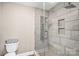 Modern bathroom featuring a spacious glass shower with rainfall showerhead and tiled walls at 247 Reese Wilson Rd, Belmont, NC 28012