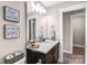 Bathroom vanity with granite countertop, dark wood cabinets, and stylish decor at 247 Reese Wilson Rd, Belmont, NC 28012