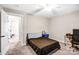 Bedroom featuring carpet flooring, ceiling fan, open door and modern furniture at 247 Reese Wilson Rd, Belmont, NC 28012