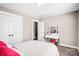 Bedroom with a makeup vanity, walk in closet, and neutral color palette at 247 Reese Wilson Rd, Belmont, NC 28012
