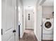 Hallway view with neutral walls and doors leading to other rooms, including laundry room and bathroom at 247 Reese Wilson Rd, Belmont, NC 28012