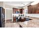 A well-lit kitchen featuring granite countertops, stainless steel appliances, and ample cabinet space at 247 Reese Wilson Rd, Belmont, NC 28012