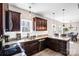 An open kitchen featuring stainless steel appliances, granite countertops, and stylish pendant lighting at 247 Reese Wilson Rd, Belmont, NC 28012