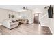 Bright living room with a ceiling fan, a wooden front door, two sofas, and beautiful vinyl flooring at 247 Reese Wilson Rd, Belmont, NC 28012