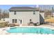 The house with a large pool and patio, including a grill, bench and chairs at 247 Reese Wilson Rd, Belmont, NC 28012