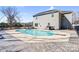 Back of the home overlooking an in-ground pool with patio and grilling area at 247 Reese Wilson Rd, Belmont, NC 28012