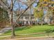 Charming two-story home featuring a well-manicured lawn and traditional architectural details at 2600 Fernbank Dr, Charlotte, NC 28226