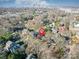 Aerial view showcasing the neighborhood, a red house, and proximity to the city skyline at 2729 Duncan Ave, Charlotte, NC 28205