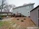 Expansive backyard with a patio, pergola, and lush landscaping at 2729 Duncan Ave, Charlotte, NC 28205