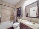 Bathroom features a shower with tiled walls, toilet and vanity with granite countertop at 2729 Duncan Ave, Charlotte, NC 28205