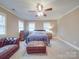 Bedroom featuring a decorative ceiling fan, carpet, and natural light at 2729 Duncan Ave, Charlotte, NC 28205