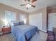 Bedroom featuring a decorative ceiling fan, natural light, and modern nightstands at 2729 Duncan Ave, Charlotte, NC 28205