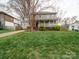 Beautiful two-story home showcasing a classic design and expansive front yard at 2729 Duncan Ave, Charlotte, NC 28205