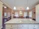 Open kitchen and dining area featuring a large island with granite countertop and ample natural light at 2729 Duncan Ave, Charlotte, NC 28205