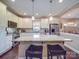 Spacious kitchen features a granite island with stool seating and stainless steel appliances at 2729 Duncan Ave, Charlotte, NC 28205