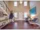 Spacious living room with a staircase, hardwood flooring, and natural light at 2729 Duncan Ave, Charlotte, NC 28205