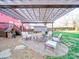 Stone patio with pergola, fire pit and lounge seating at 2729 Duncan Ave, Charlotte, NC 28205