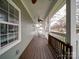 Relaxing front porch with wooden flooring, ceiling fan, and neighborhood views at 2729 Duncan Ave, Charlotte, NC 28205