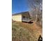 Exterior of home features a wooden deck with a lawn and tree view at 3002 Willamette Valley Dr, Charlotte, NC 28215