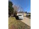 Home exterior featuring a one car garage, driveway, and manicured yard at 3002 Willamette Valley Dr, Charlotte, NC 28215