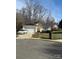 Charming single-story home featuring a driveway, garage, solar panels, and manicured landscaping at 3002 Willamette Valley Dr, Charlotte, NC 28215