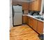 Functional kitchen with wood cabinets, stainless steel refrigerator and laminate countertops at 3002 Willamette Valley Dr, Charlotte, NC 28215