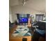 Cozy living room featuring a vaulted ceiling, ceiling fan, and comfortable seating at 3002 Willamette Valley Dr, Charlotte, NC 28215