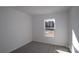 Cozy bedroom with neutral carpet and natural light streaming through the window at 3509 Nimbell Rd, Monroe, NC 28110
