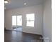 Open-concept living room with abundant natural light and sliding doors at 3509 Nimbell Rd, Monroe, NC 28110