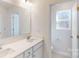 Bright bathroom with double sink vanity and a separate toilet room at 3562 Nimbell Rd, Monroe, NC 28110