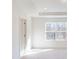 Bright bedroom featuring a large window with natural light and neutral carpeting at 3562 Nimbell Rd, Monroe, NC 28110