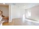 Spacious living room with wood flooring, recessed lighting, and access to the staircase at 3562 Nimbell Rd, Monroe, NC 28110
