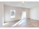 Bright, spacious room featuring wood floors, natural light from windows and a sliding glass door at 3562 Nimbell Rd, Monroe, NC 28110