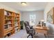 Well-lit office space with built-in shelves, comfortable chair, and a large wooden desk at 3562 Nimbell Rd, Monroe, NC 28110