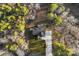 Aerial view of home, revealing its setting within a lush, wooded landscape at 40934 Deer Haven Dr, Albemarle, NC 28001