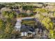 Expansive aerial view showcasing the home's wooded surroundings and long driveway at 40934 Deer Haven Dr, Albemarle, NC 28001
