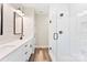 Bathroom featuring white vanity with double sinks and frameless shower with white subway tile at 40934 Deer Haven Dr, Albemarle, NC 28001