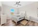 Cozy bedroom features neutral walls, a large window, and white furniture at 40934 Deer Haven Dr, Albemarle, NC 28001