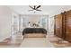 Bright and airy bedroom with wood floors, a ceiling fan, and a sliding barn door at 40934 Deer Haven Dr, Albemarle, NC 28001