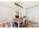 Dining room featuring modern lighting, hardwood floors, and an adjacent built-in at 40934 Deer Haven Dr, Albemarle, NC 28001