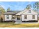 Charming single-story home featuring brick and siding exterior, well-manicured lawn, and inviting entryway at 40934 Deer Haven Dr, Albemarle, NC 28001