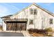 Garage side of the home shows a dark garage door and siding exterior at 40934 Deer Haven Dr, Albemarle, NC 28001