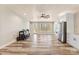Spacious living room featuring wood floors, shiplap walls, recessed lighting, and stainless steel refrigerator at 40934 Deer Haven Dr, Albemarle, NC 28001