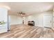 Living room with recessed lights, white ceiling, white walls, wood floors, and kitchenette at 40934 Deer Haven Dr, Albemarle, NC 28001