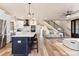 Spacious open concept with a large island, stainless steel appliances, and a coffered ceiling with fan at 40934 Deer Haven Dr, Albemarle, NC 28001
